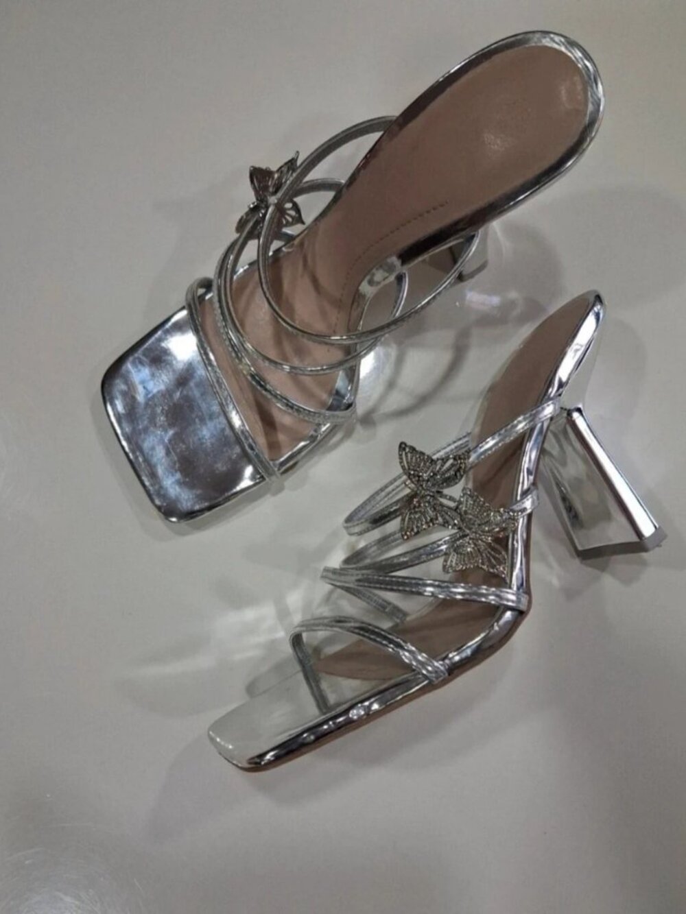 Silver heeled sandals with a butterfly US 8.5